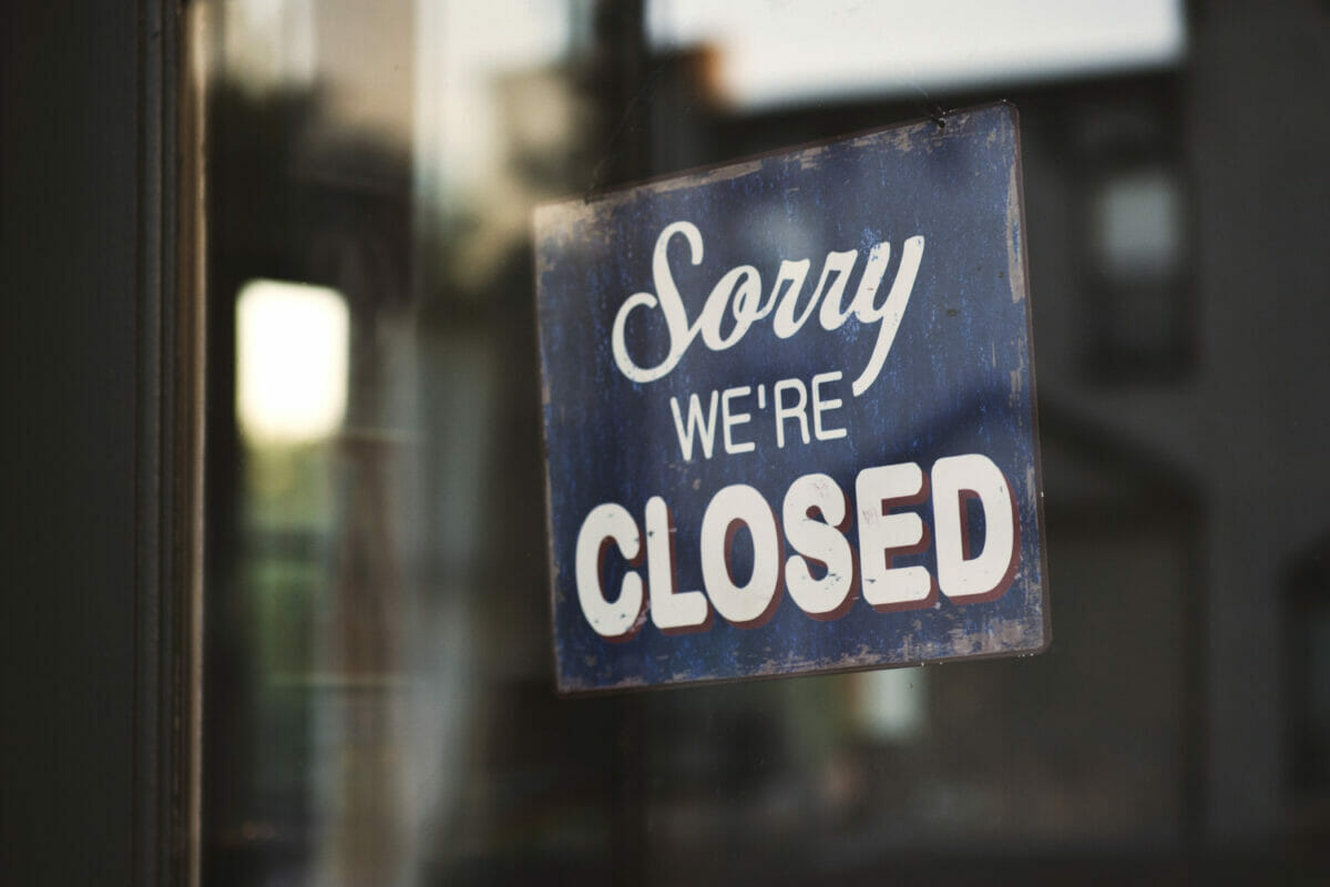 closeup-shot-sign-that-says-sorry-we-re-closed-hanging-glass-door