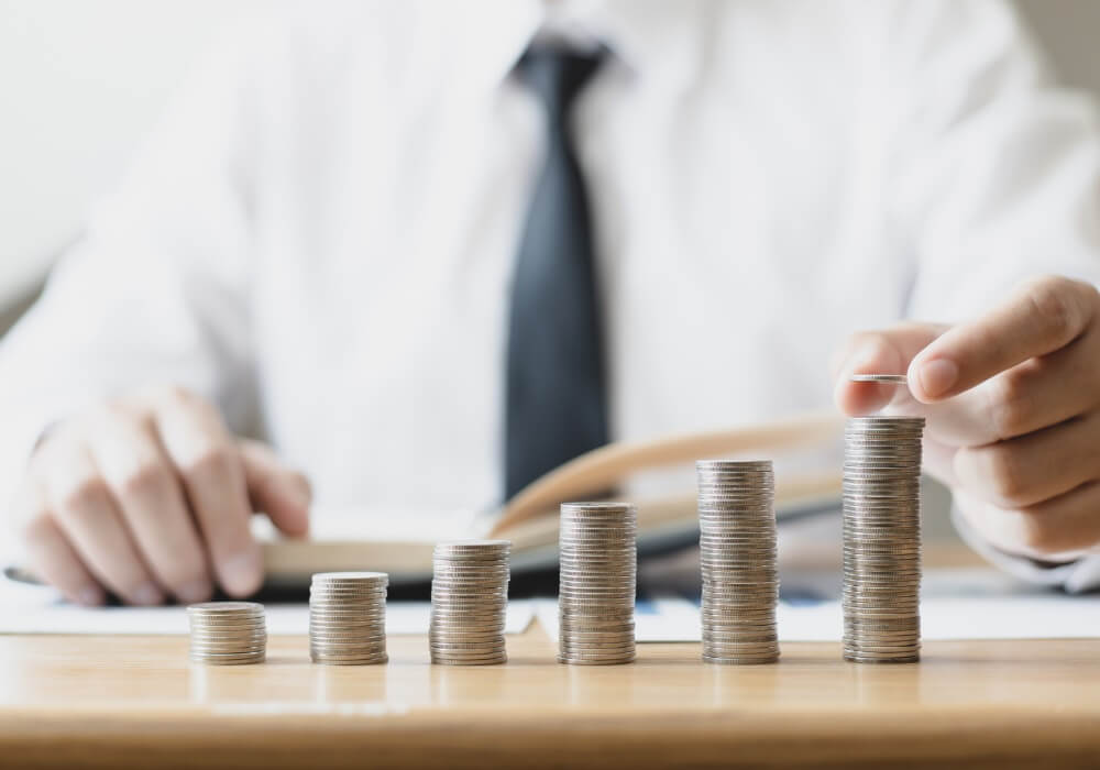 businessman stacking coins